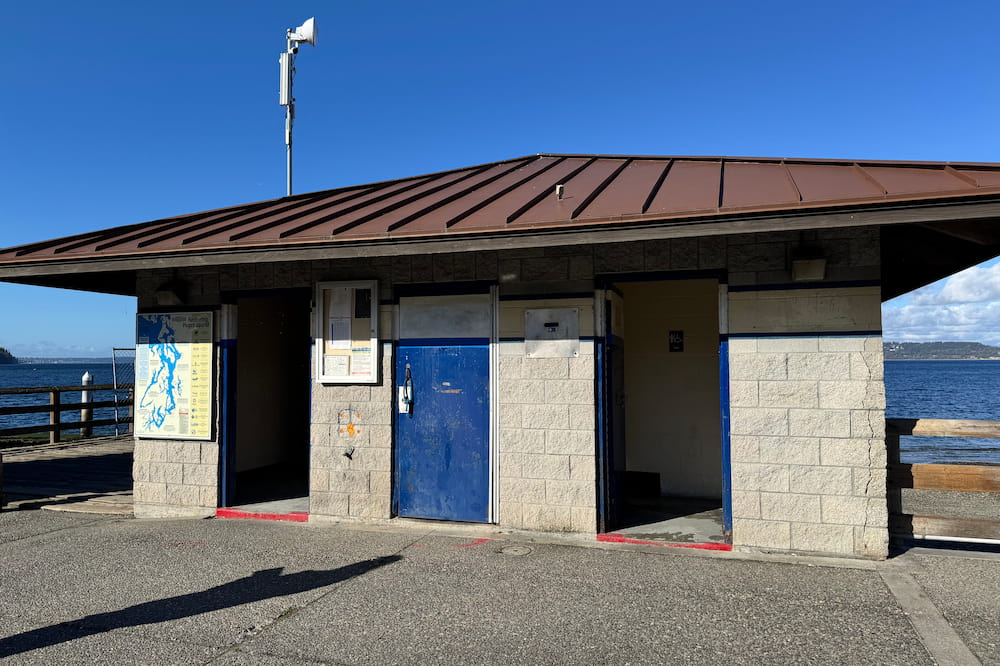 Public restrooms located on the boardwalk above the beach.